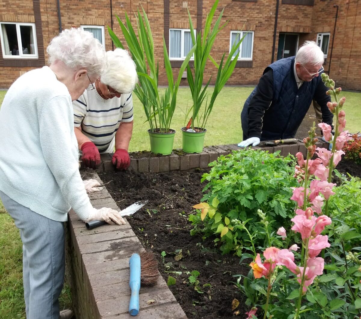 Residents tending to the community garden